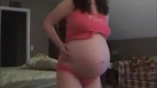 Sexy preggo millie shows her belly
